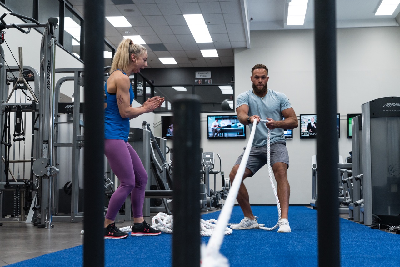 Personal trainer, Kai doing a sled pull at downtown Calgary's Fifth Avenue Club